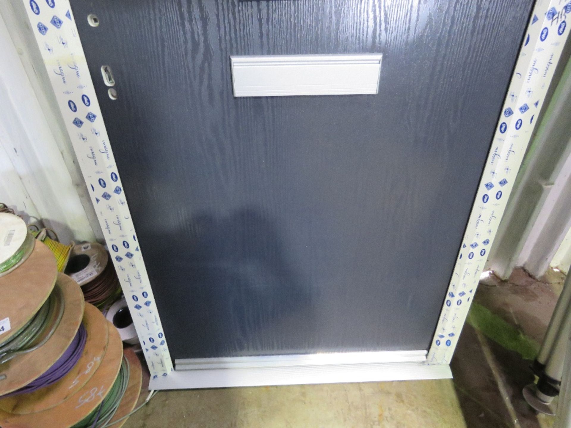 HEAVY DUTY COMPOSITE DOOR IN FRAME ( 1M WIDE X 2M HEIGHT OVERALL FRAME SIZE APPROX) THIS LOT IS S