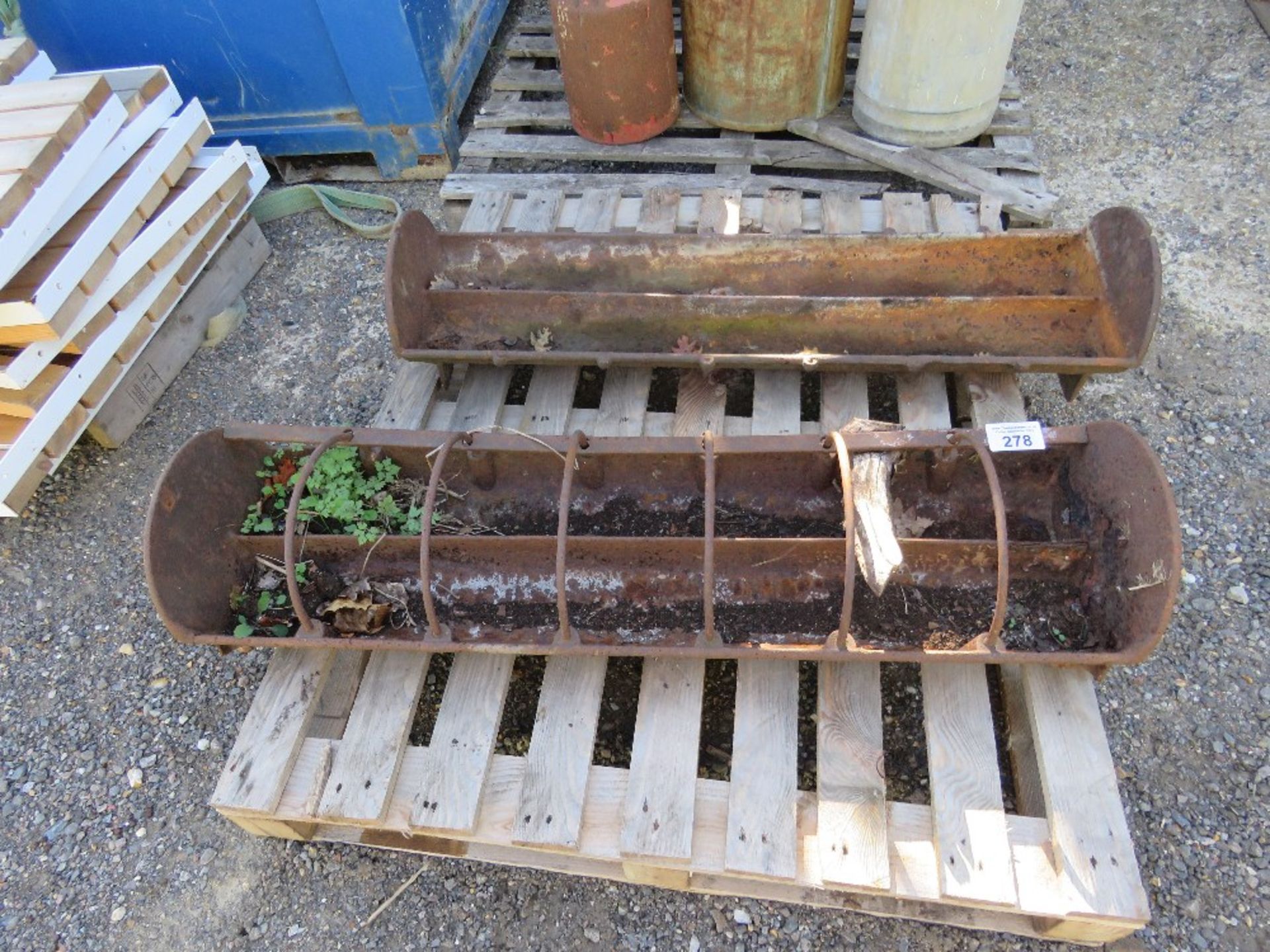 2 X CAST IRON FEED TROUGH PLANTERS. THIS LOT IS SOLD UNDER THE AUCTIONEERS MARGIN SCHEME, THEREFO