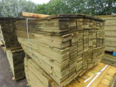 LARGE PACK OF TREATED FEATHER EDGE TIMBER CLADDING BOARDS: 1.2M LENGTH X 100MM WIDTH APPROX.