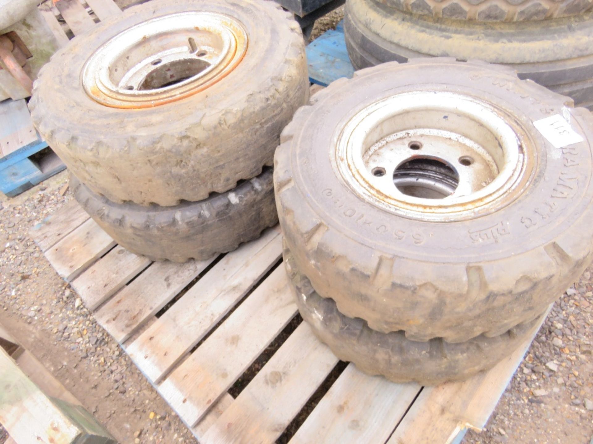4 X SOLID FORKLIFT WHEELS AND TYRES 7.00X12 AND 6.50 X 10. THIS LOT IS SOLD UNDER THE AUCTIONEER - Image 2 of 5