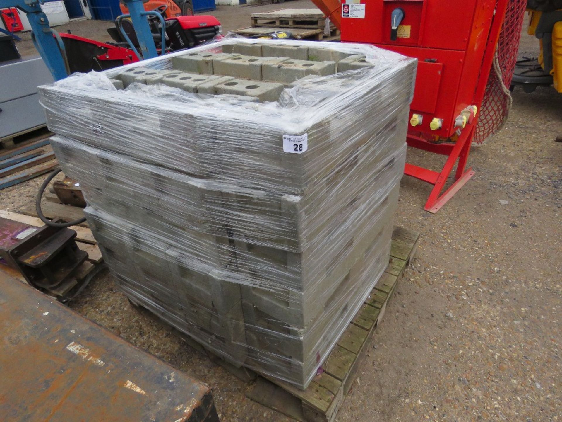 PALLET CONTAINING 30NO HERAS TYPE SITE FENCE BLOCKS / FEET. THIS LOT IS SOLD UNDER THE AUCTIONEER