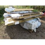 QUANTITY OF ASSORTED FENCING TIMBERS AND POSTS PLUS A METAL PANEL.