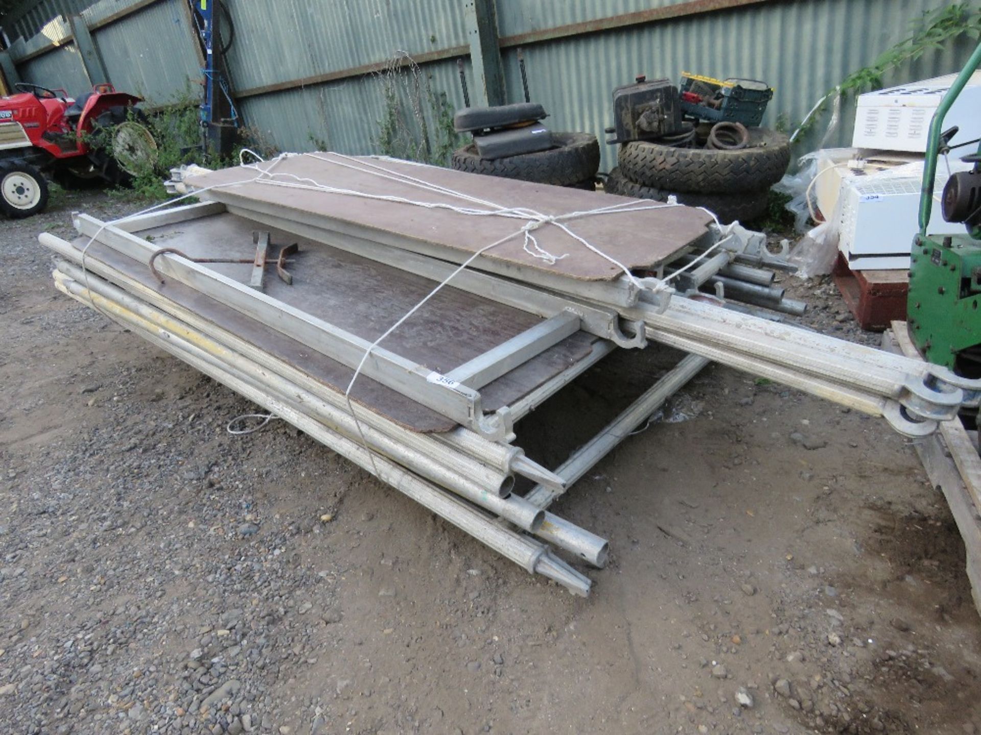 ALUMINIUM SCAFFOLD TOWER WITH BOARDS AND POLES, 6 SECTIONS. OWNER RETIRING. THIS LOT IS SOLD UNDE
