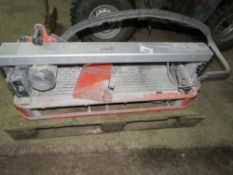 TILE CUTTING SAWBENCH WITH LEGS, 240VOLT POWERED. THIS LOT IS SOLD UNDER THE AUCTIONEERS MARGIN S