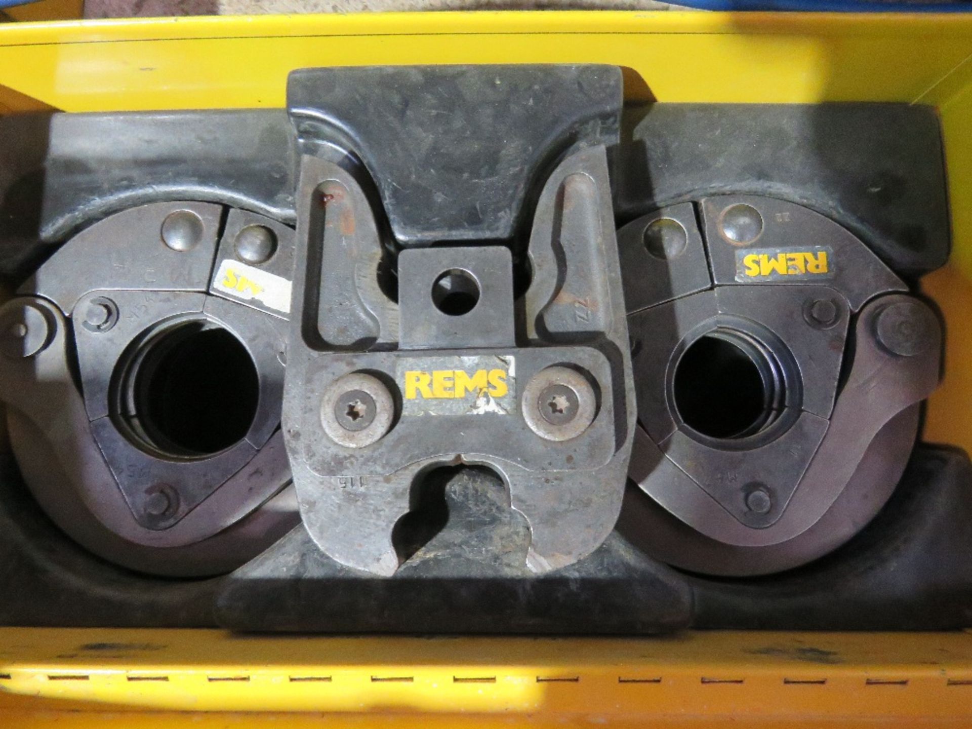 BOX CONTAINING 3NO REMS POWER CRIMPING PRESS HEADS AS SHOWN.