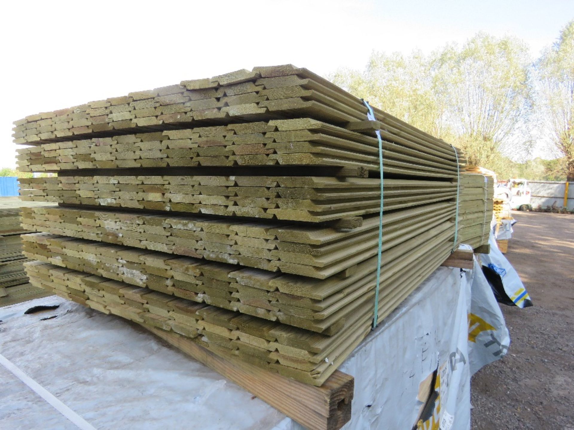 SMALL PACK OF PRESSURE TREATED SHIPLAP FENCE CLADDING TIMBER BOARDS. 1.42M LENGTH X 100MM WIDTH APPR