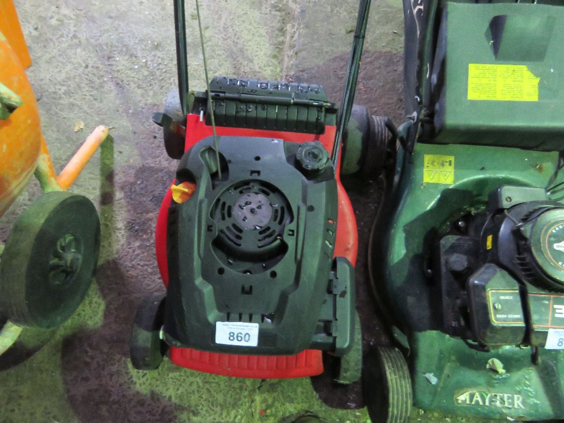 RED LAWNMOWER- NO BAG. THIS LOT IS SOLD UNDER THE AUCTIONEERS MARGIN SCHEME, THEREFORE NO VAT WI