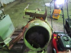 PETROL BELLE CEMENT MIXER WITH STAND. THIS LOT IS SOLD UNDER THE AUCTIONEERS MARGIN SCHEME, THER