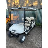 EZGO SHUTTLE4 LONG WHEEL BASE ELECTRIC GOLF BUGGY WITH CHARGER. BATTERY FLAT, UNTESTED. WITH KEY.