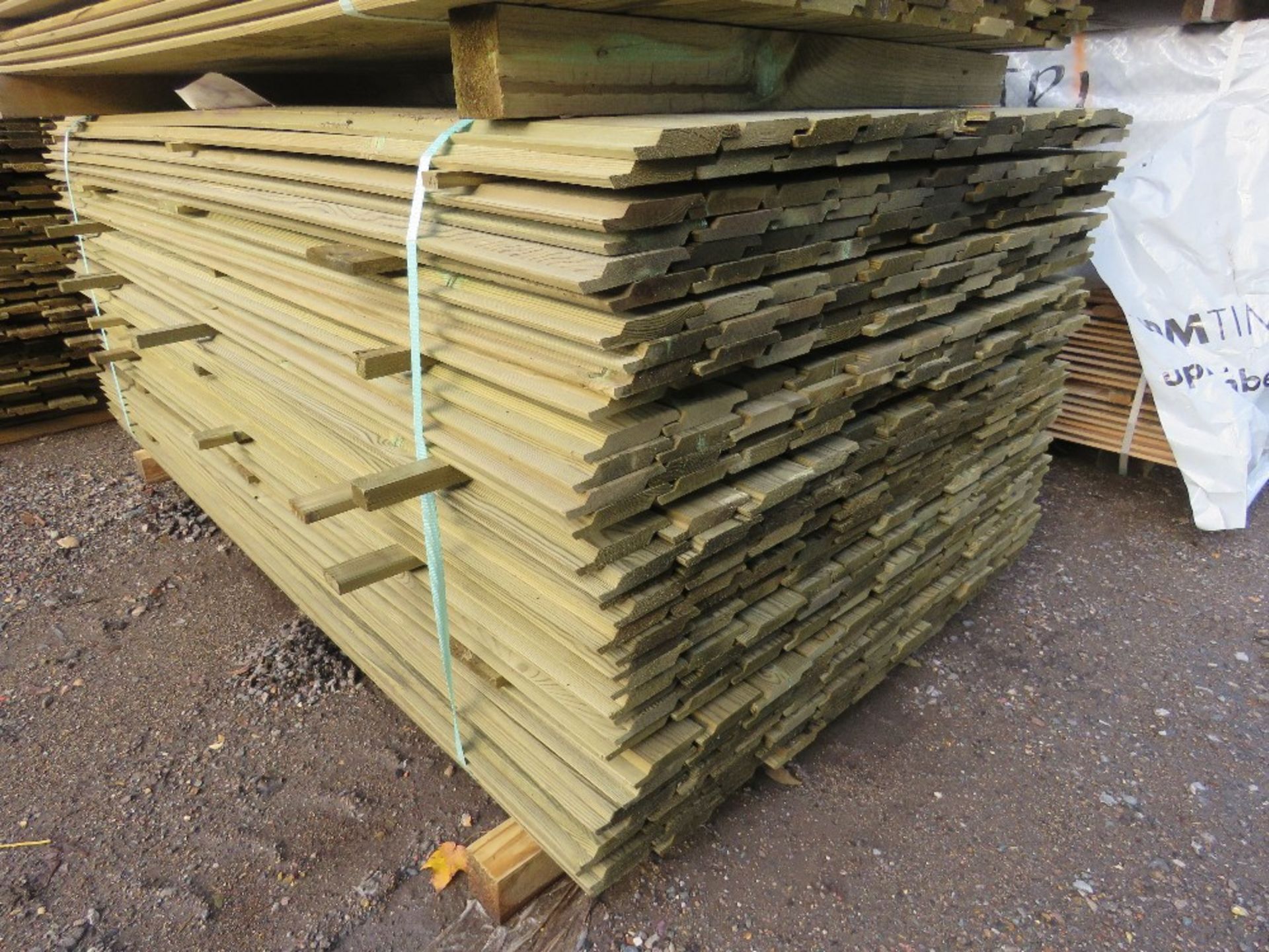 LARGE PACK OF TREATED SHIPLAP TIMBER CLADDING BOARDS. 1.72M LENGTH X 100MM WIDTH APPROX