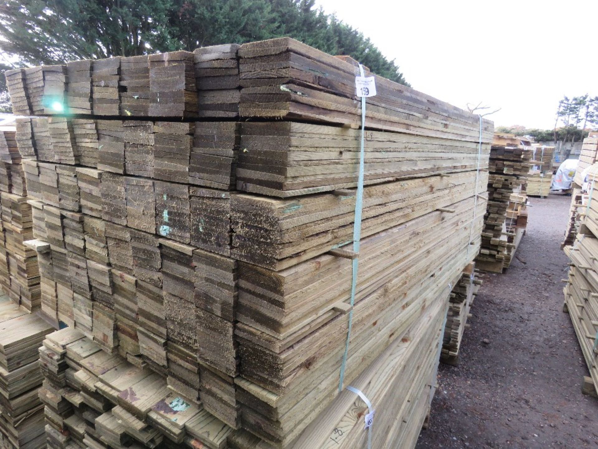 LARGE PACK OF TREATED FEATHER EDGE CLADDING BOARDS: 1.8M LENGTH X 100MM WIDTH APPROX.