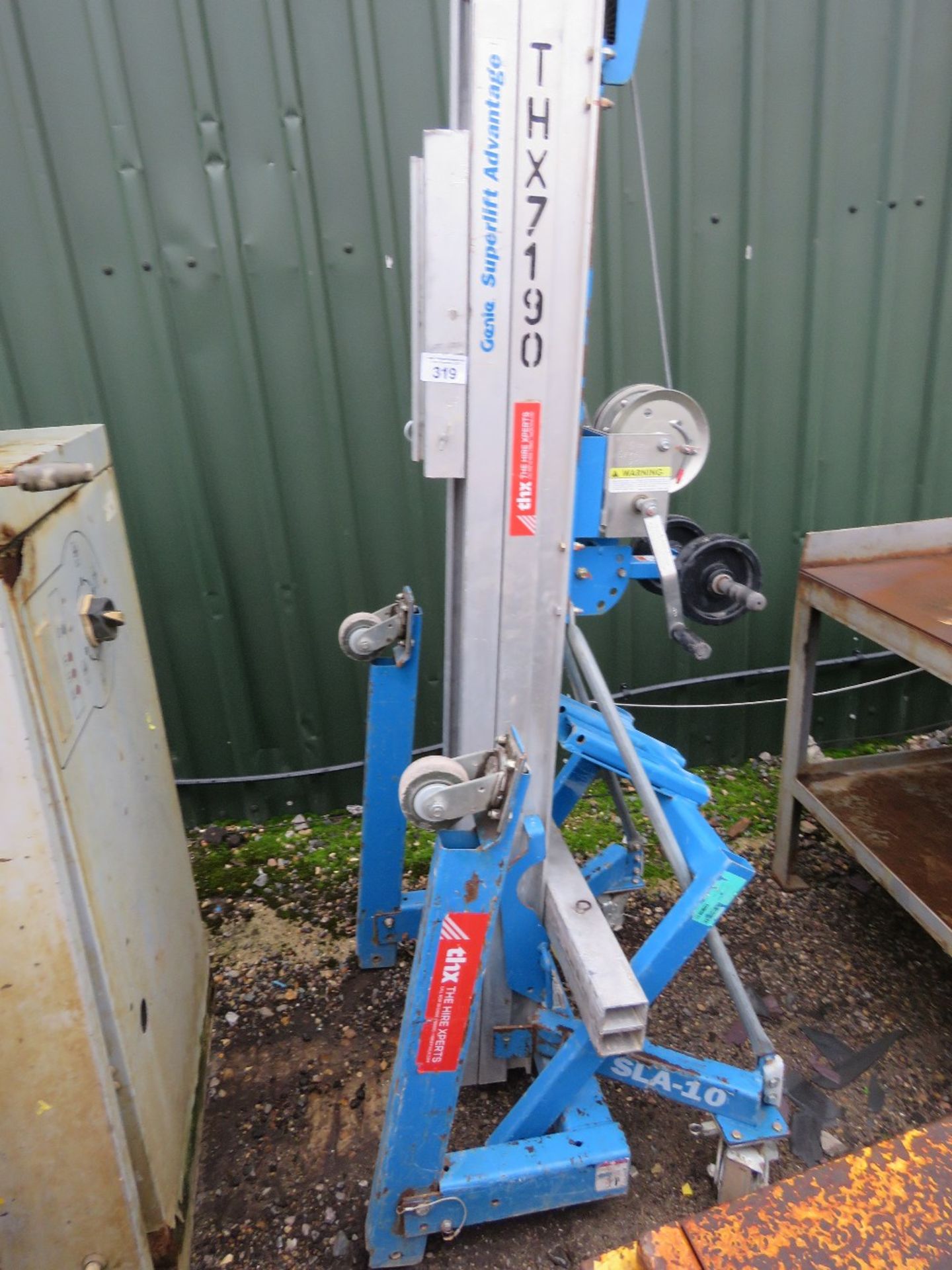 GENIE SLA10 MANUAL MATERIAL LIFT WITH FORKS AND EXTENSION SLEEVES. THX7190