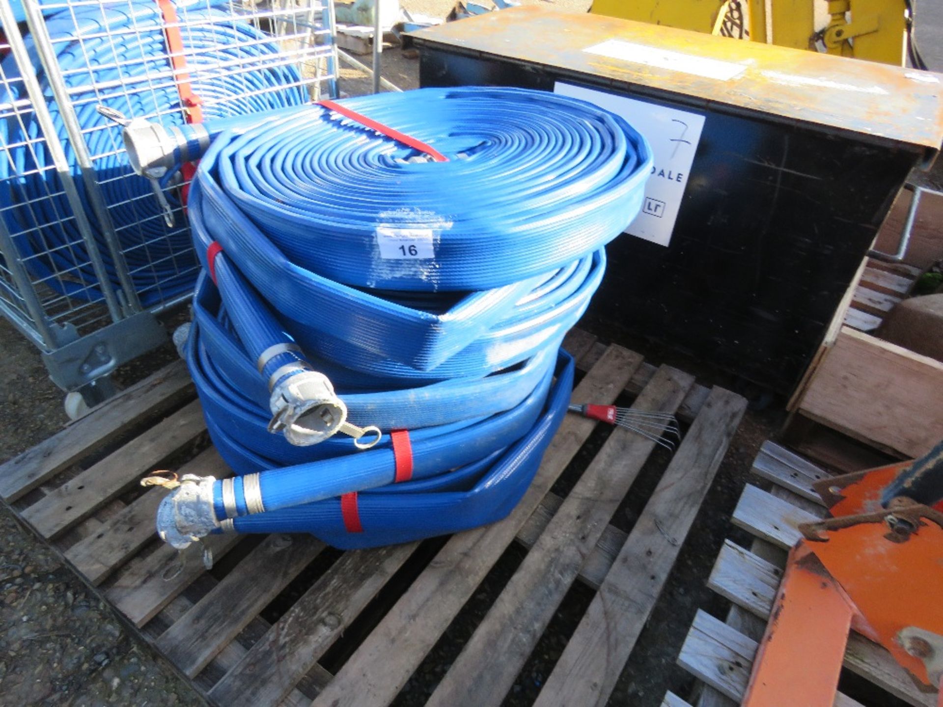 6 X LAY FLAT HOSES. 60MM WIDTH APPROX. LITTLE/ UNUSED. THIS LOT IS SOLD UNDER THE AUCTIONEERS MA