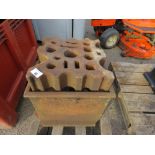 LARGE SWAGING BLOCK ON A STAND.