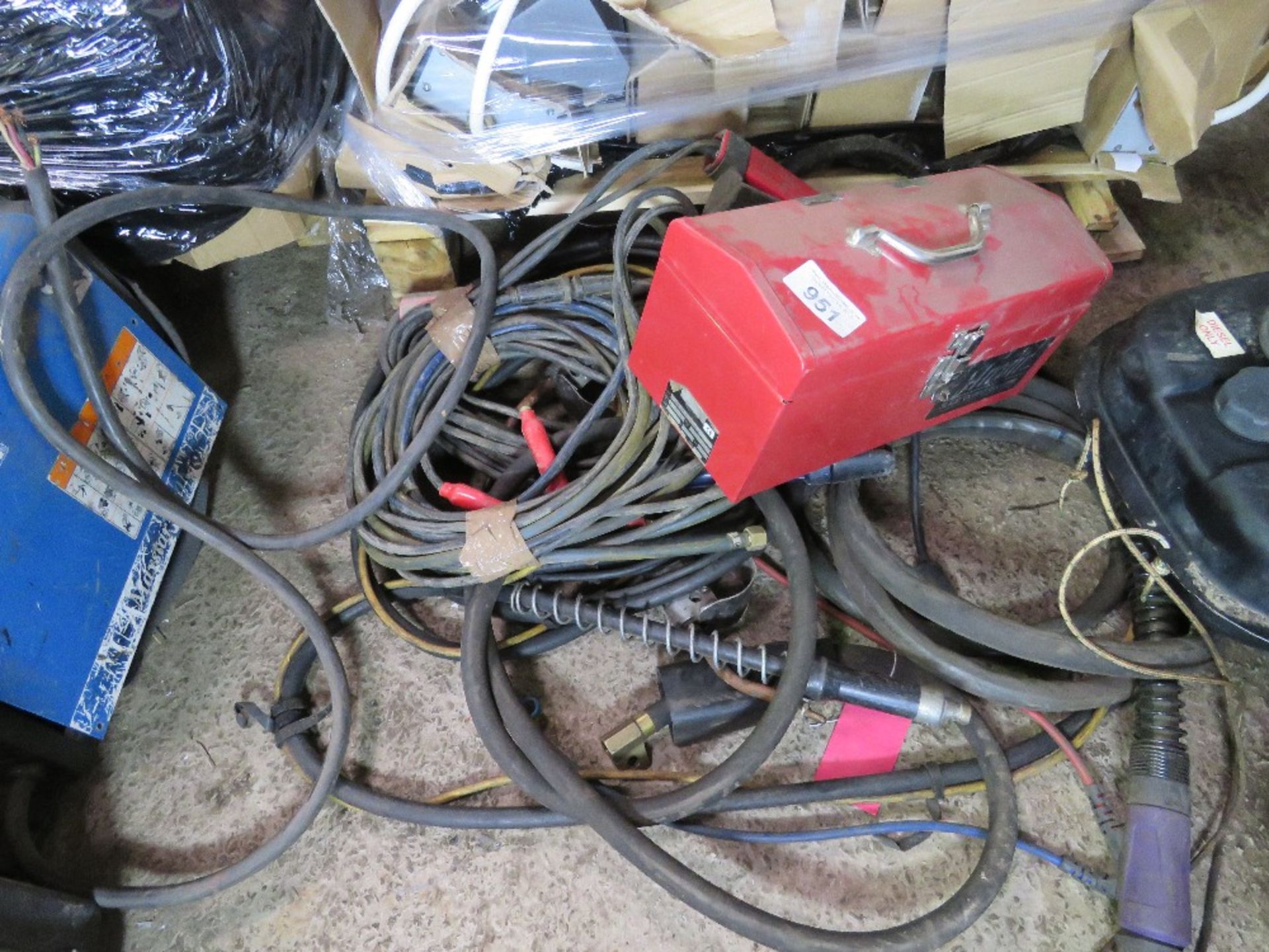 RED TOOL BOX PLUS ASSORTED WELDING LEADS/GUNS.