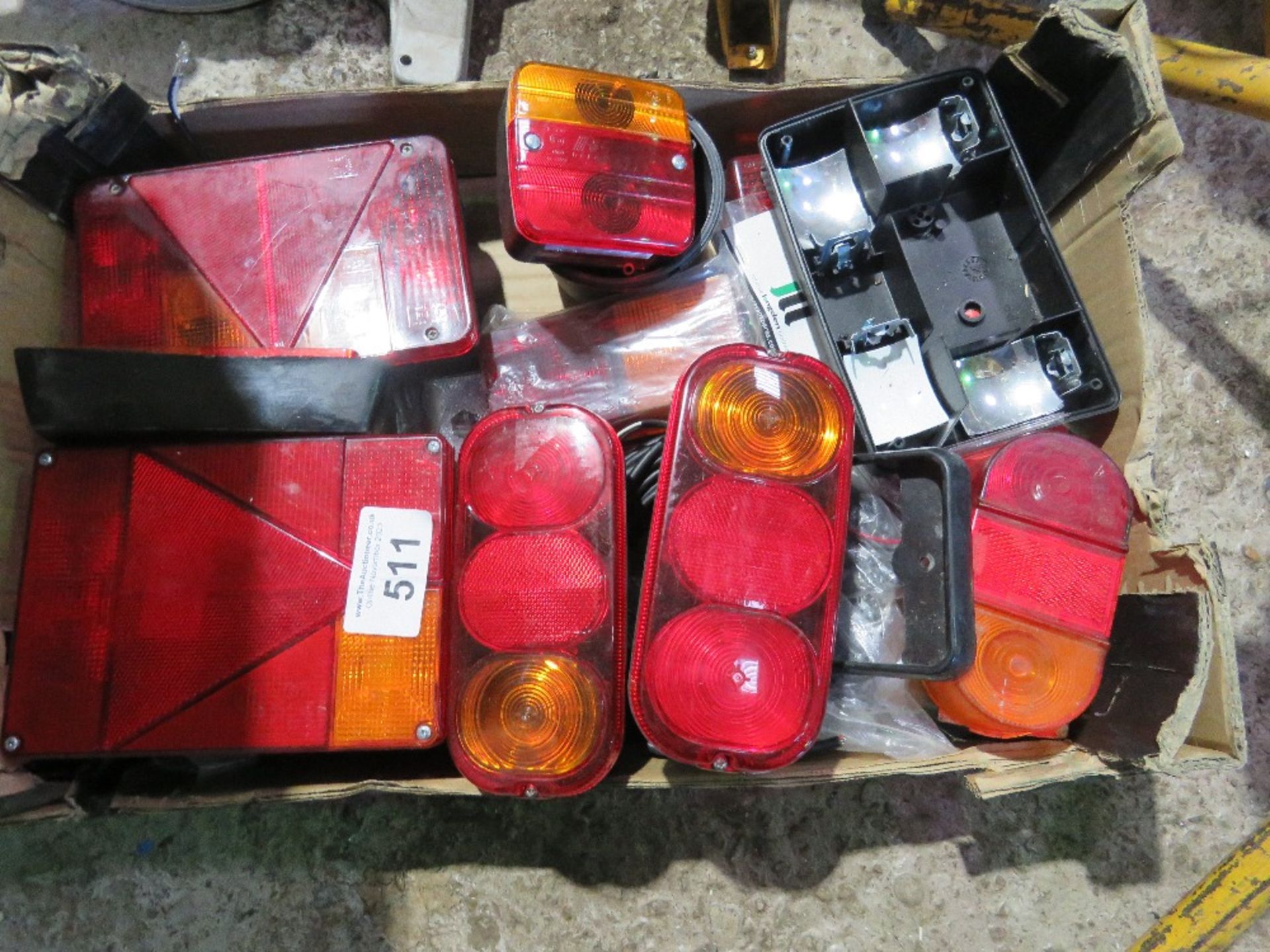 TRAY OF TRAILER LIGHTS AND LENSES.