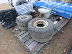 4 X SOLID FORKLIFT WHEELS AND TYRES 7.00X12 AND 6.50 X 10. THIS LOT IS SOLD UNDER THE AUCTIONEER