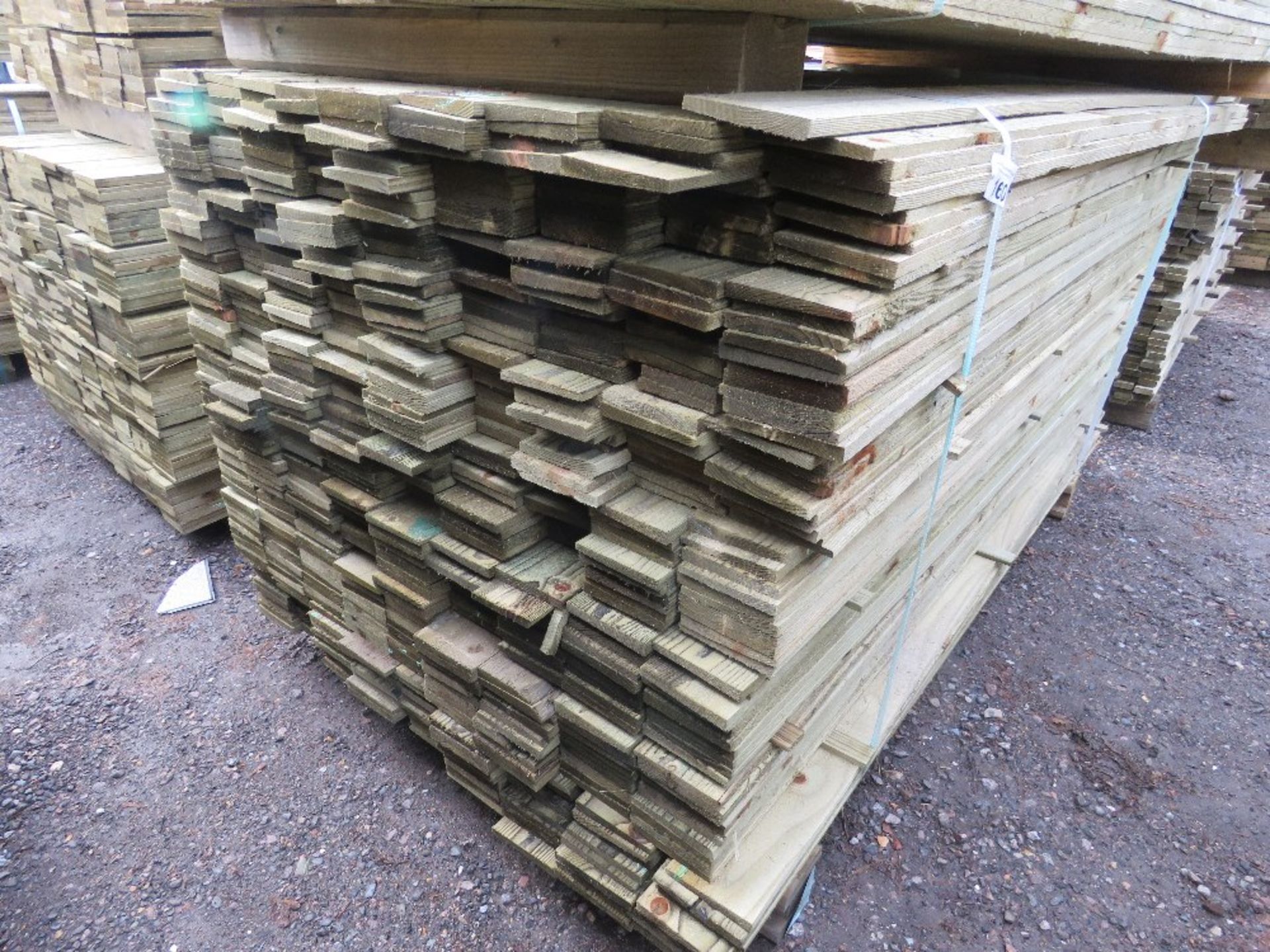 LARGE PACK OF TREATED FEATHER EDGE CLADDING BOARDS: 1.8M LENGTH X 100MM WIDTH APPROX.
