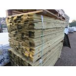 LARGE PACK OF TREATED FEATHEREDGE TIMBER CLADDING BOARDS. 1.8M LENGTH X 100MM WIDTH APPROX.