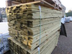 LARGE PACK OF TREATED FEATHEREDGE TIMBER CLADDING BOARDS. 1.8M LENGTH X 100MM WIDTH APPROX.
