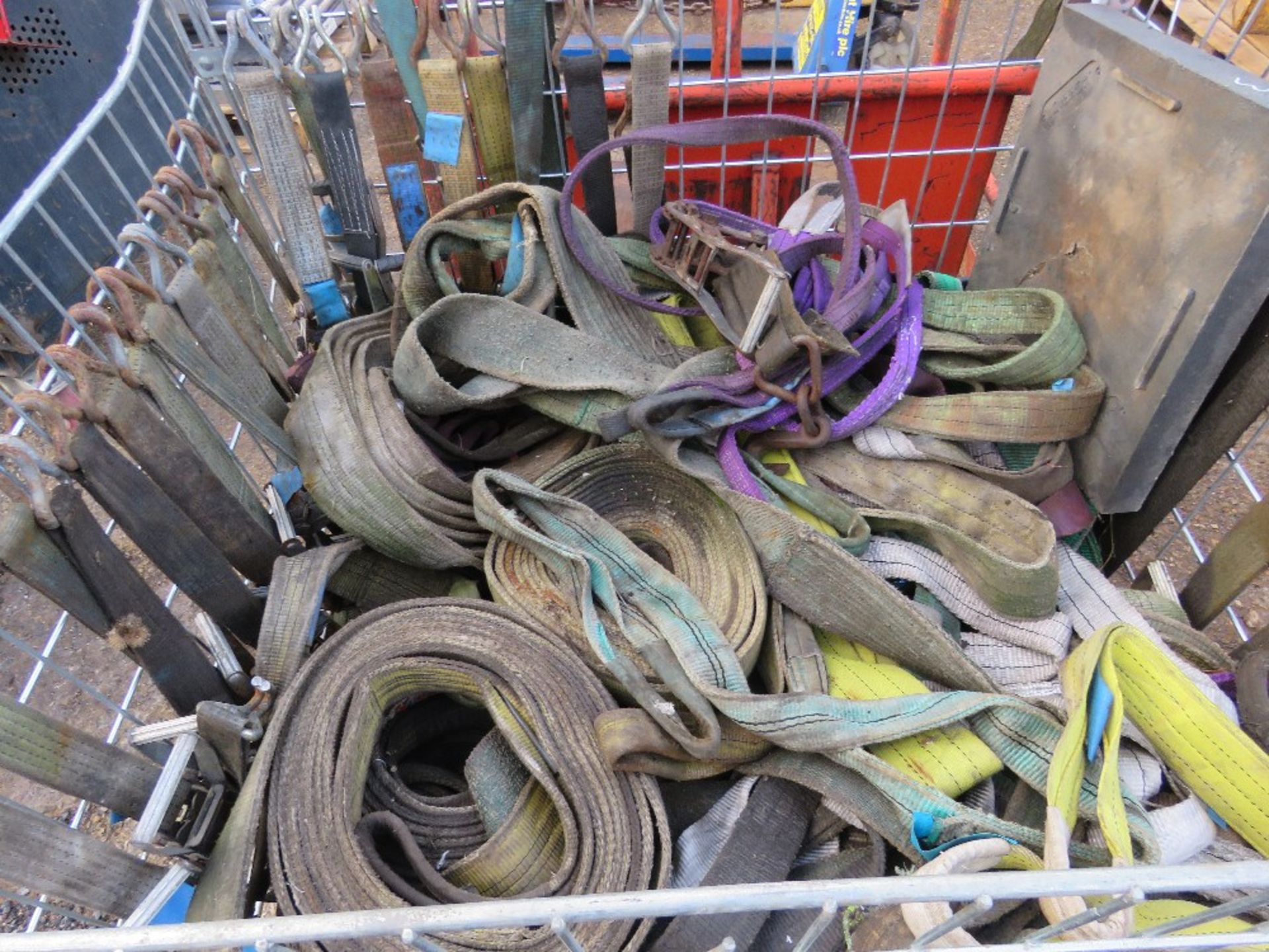 LARGE STILLAGE CONTAINING ASSORTED LIFTING STRAPS AND RATCHET STRAPS ETC.
