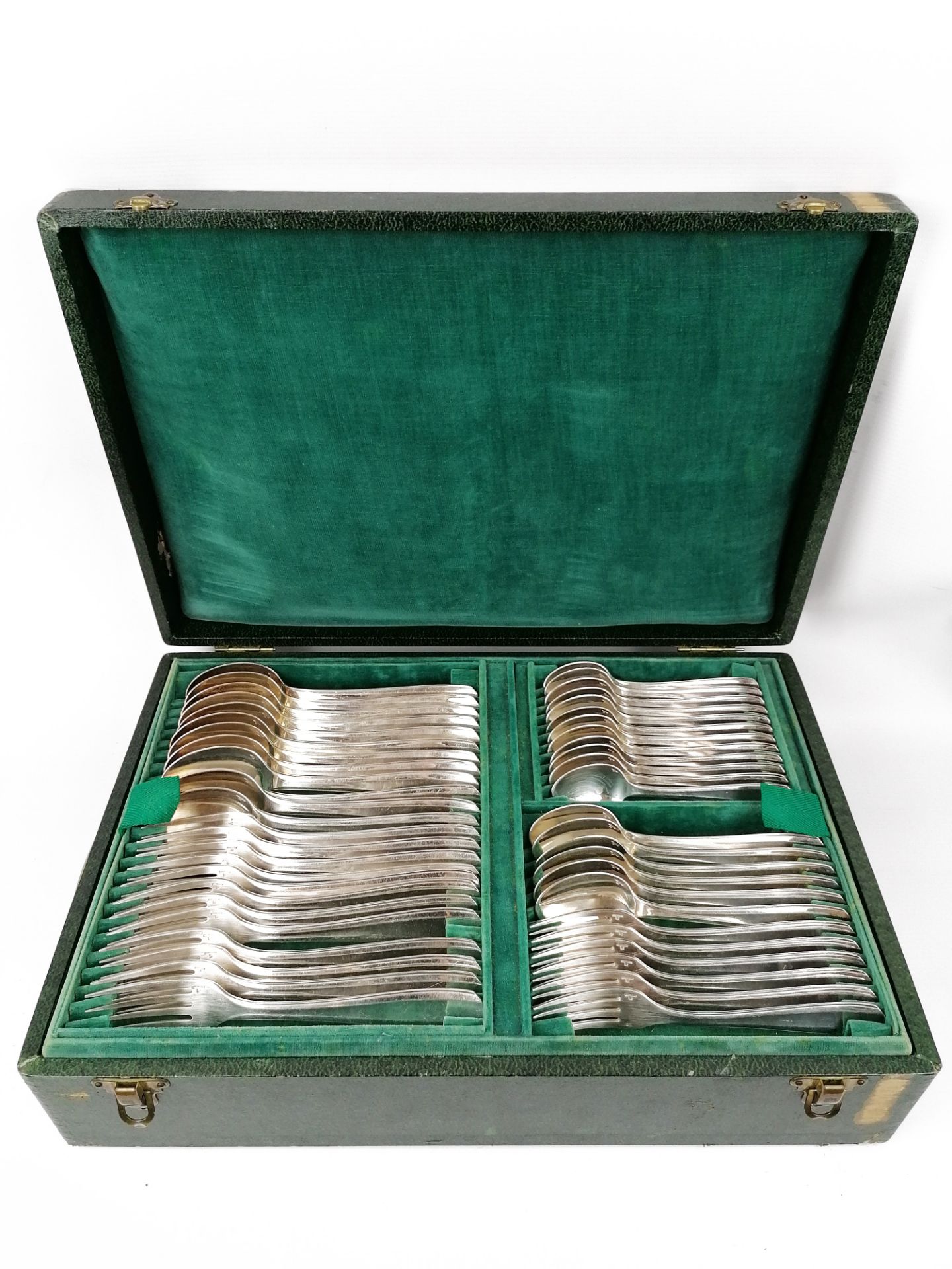 Alfenide,Silver metal housewife, Art Deco model, comprising:- 12 forks- 12 spoons- 6 spoons and 6 de