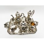 Silver metal tea and coffee service, with rockery patterns and acanthus leaves, including a teapot,