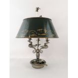 Silver metal bottle lamp with three arms of lights supported by swans.Green lacquered sheet lamp