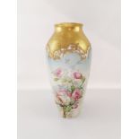 Limoges, 20th centuryBalustrous porcelain shape vase with floral polychrome and golden enhanceme