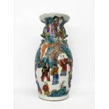 China, 19th centuryPorcelain vase, with a palace stage scene on an emerald green background.