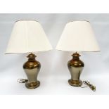 Pair of bedside lamps, representing a bronze vase.H .: 85 cm.With lampshade.