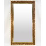 Rectangular and golden rectangular wooden mirror with rips decoration.H .: 134 cmL .: 74 cm