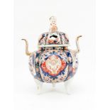 ASIA,Burnt-flam in tripod porcelain with red and gold blue decoration known as "imari".The c
