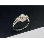 18K gray gold ring (750 thousandths) openwork, centered with a diamond cut in shiny calibrating 0.30