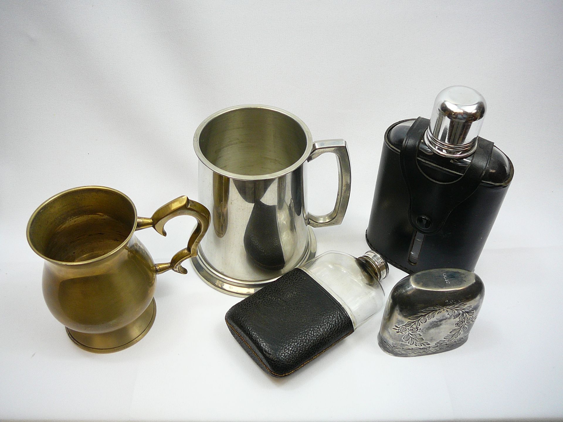 Two pewter tankards and hip flasks