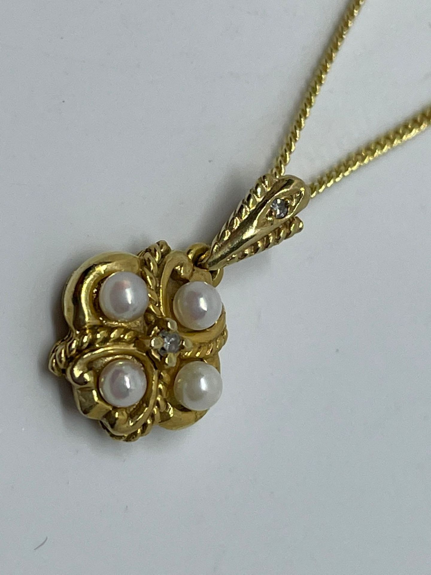 9 ct gold pearl and diamond pendant and chain