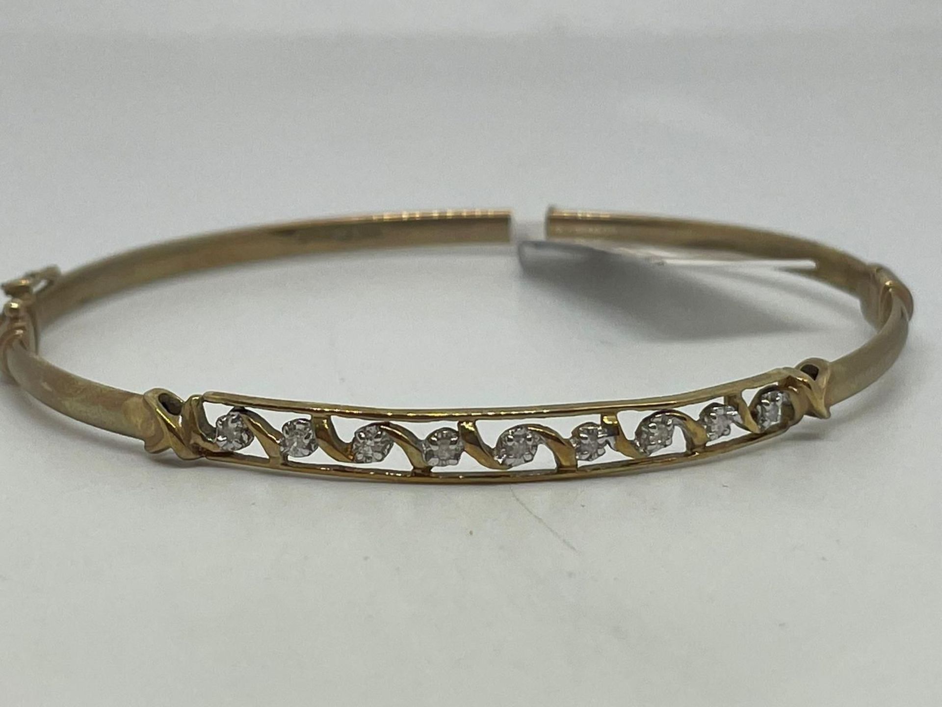 9ct gold diamond hinged bangle