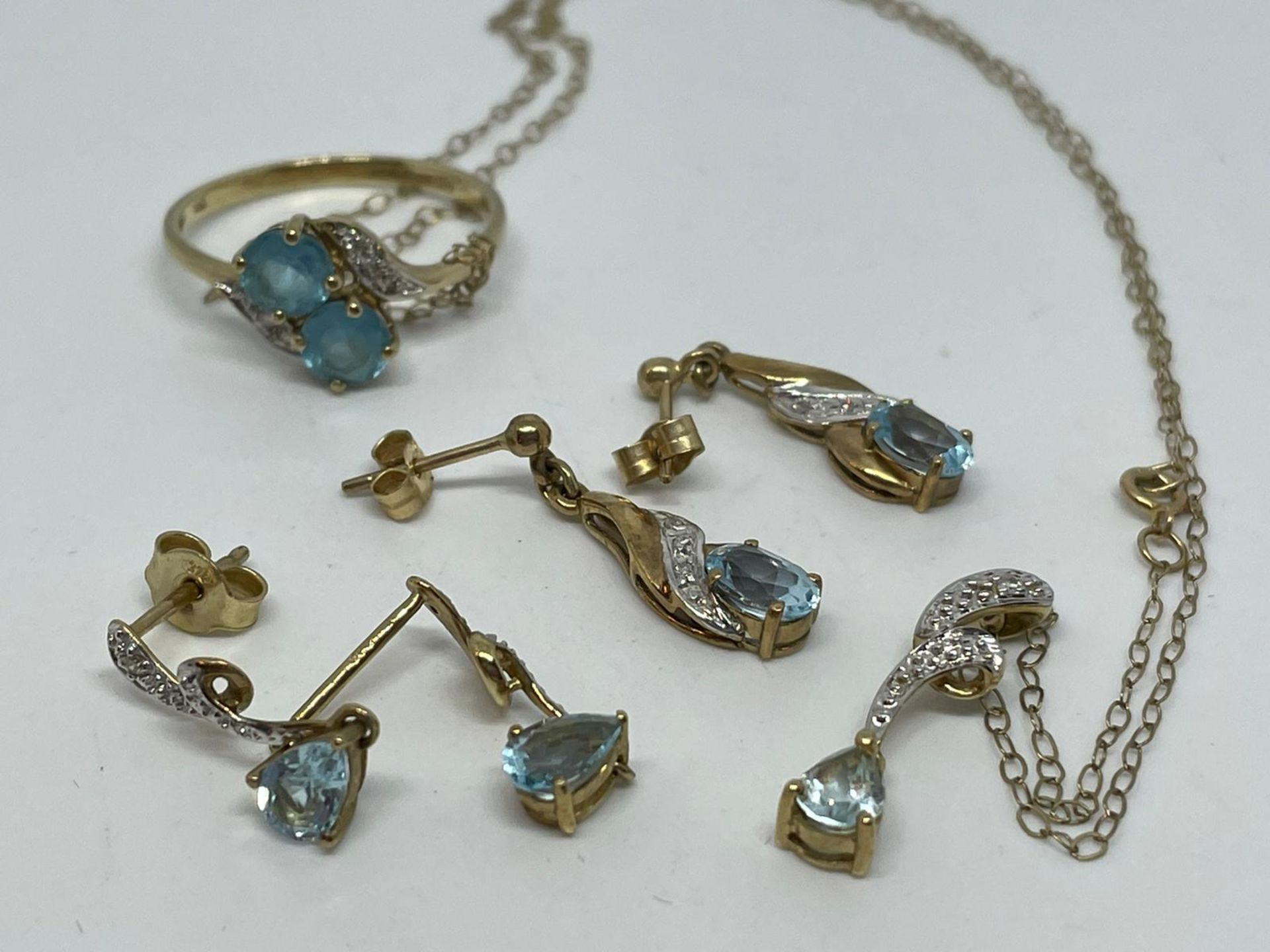 9 ct gold assorted blue topaz and diamond earrings, ring and necklace - Image 2 of 2