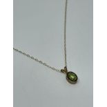 9 ct gold peridot pendant and chain