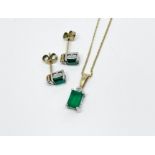 9 ct gold emerald and diamond pendant