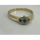18 ct gold emerald and diamond cluster ring