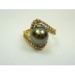 Black pearl and diamonds gold ring