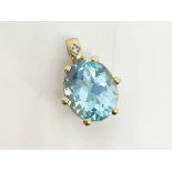 9 ct gold blue topaz pendant