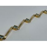 18 ct gold blue topaz articulated bracelet