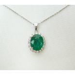 18ct white gold diamond and emerald pendant