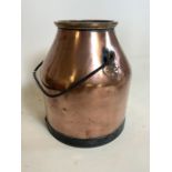 A large cooper and brass pot with iron base and handle. W:31.5cm x D:31.5cm x H:33cm
