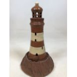 A pottery lighthouse marked to base MCL W:20cm x H:40cm