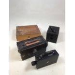 A Kodak cine camera - model BB Junior in Orono glam case with a box camera and a wooden box with