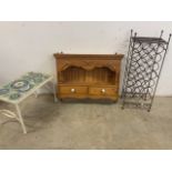 A pine kitchen wall cupboard with two drawers also with a wine rack and a tiled table. W:76cm x D: