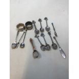 A quantity of hallmarked silver, white metal and EPNS spoons and napkin rings. Total hallmarked